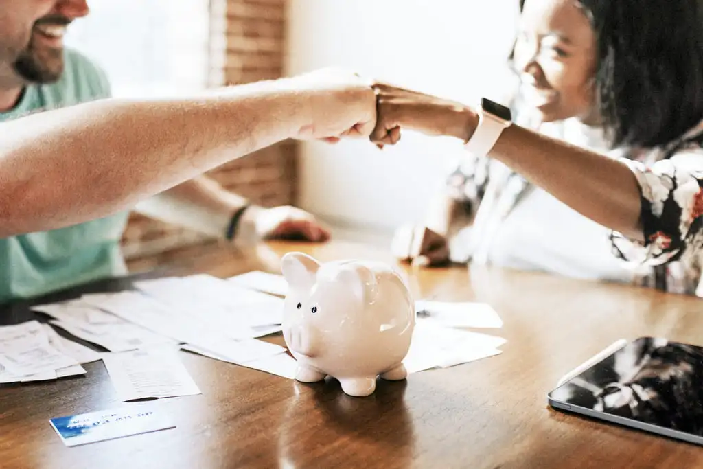 financial consultants celebrating with fist bump